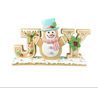 Decorative sign with a snowman design inside the letters 'JOY' on a white background.